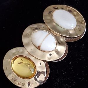 Bold goldtone stretch bracelet with white, cream and yellow cabochons